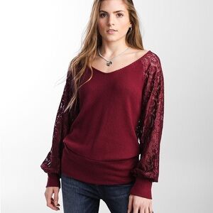 Day Trip Pierced sheer laced sleeve sweater top